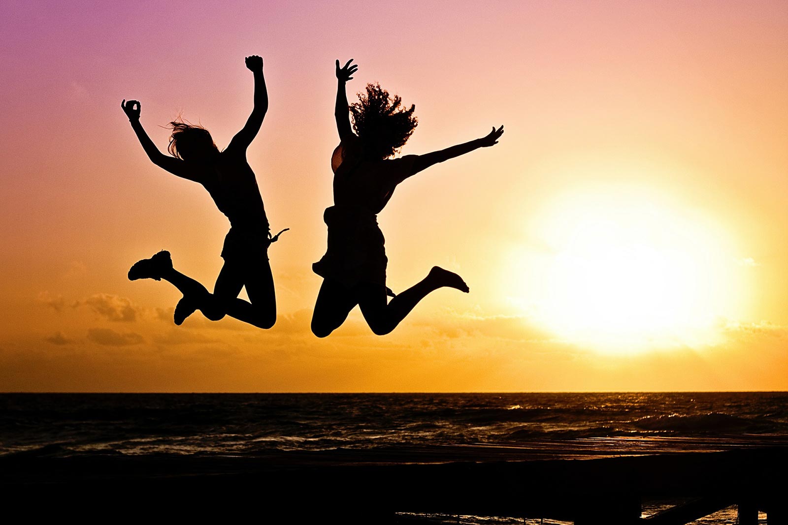 Couple jumping for joy after a session at CBT Manchester