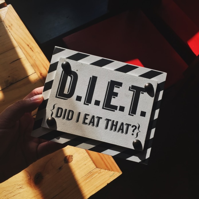 picture of a sign saying 'D.I.E.T. did I eat that?' which is what cbt for weight loss in Manchester can help with ie managing cravings