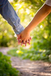 couple holding hands to show what online couple therapy can lead to