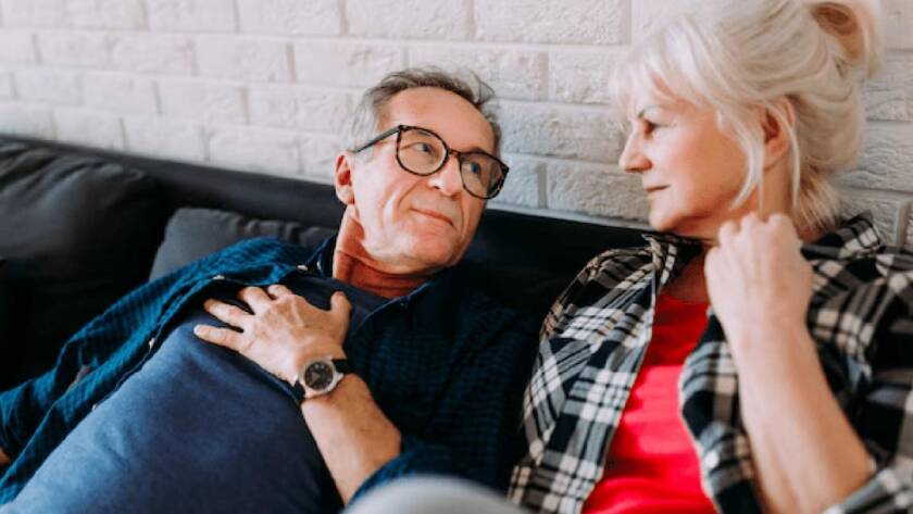 Couples Therapy couple looking at each other, hand on heart