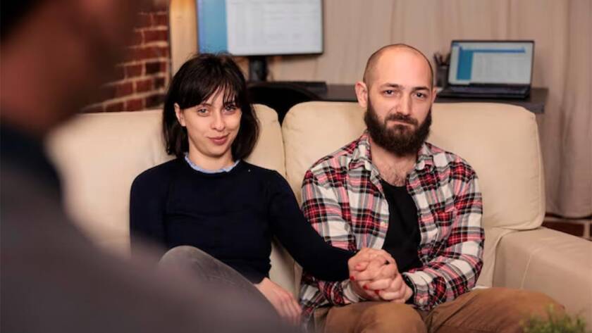 Couples Therapy with a couple on a couch talking to a therapist