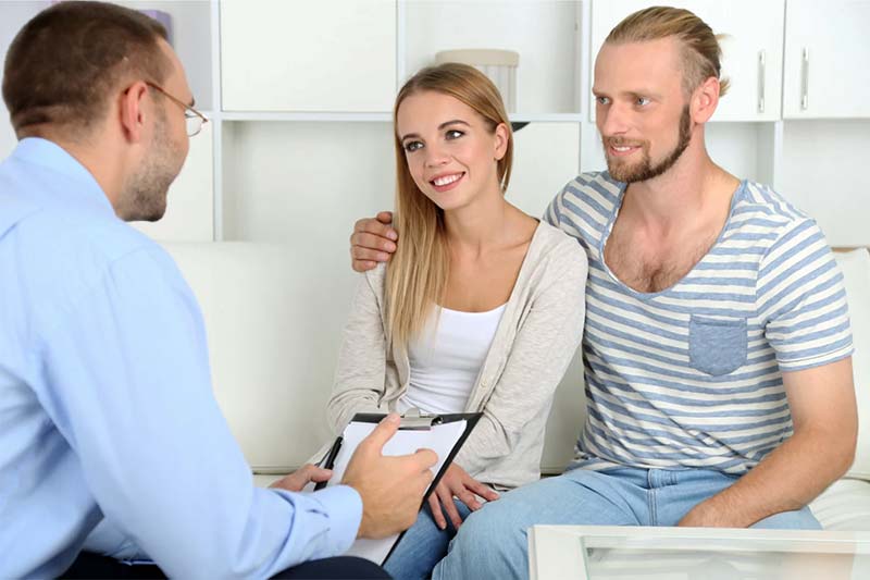 Happy young couple at CBT Therapy Manchester enjoying couples therapy